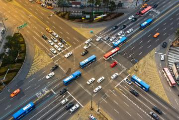 
              In a new study, MIT researchers demonstrate a machine-learning approach that can learn to control a fleet of autonomous vehicles as they approach and travel through a signalized intersection in a way that keeps traffic flowin...