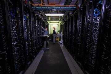 
              At the Lincoln Laboratory Supercomputing Center, researchers are making changes to cut down on energy use. One of their techniques can reduce the energy of training AI models by 80 percent.
              Photo: Glen Cooper
      
