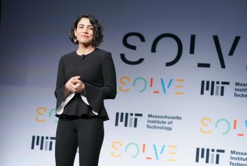 
              Hala Hanna stands on stage during a Solve event.
              Photo courtesy of MIT Solve.
      