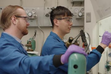 Glen Junor (left) and Fang-Yu Kuo work in the lab. 
