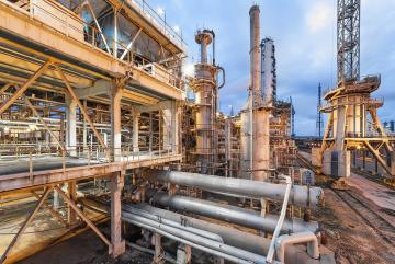 Today, most ammonia is produced using the Haber-Bosch process, a century-old method that relies on fossil fuels, in facilities like the one pictured. MIT researchers are developing computational approaches to identify materials that could enable a more sustainable alternative.