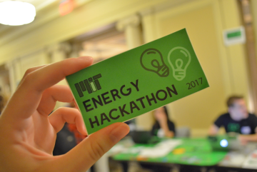 MIT Energy Hackathon leaders handed out stickers at this year's registration tables.Photo: Fatima Husain
