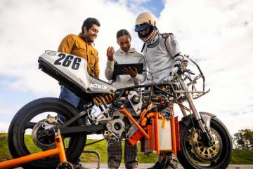 Electric Vehicle Team members (from left to right) Anand John, Rachel Mohammed, and Aditya Mehrotra '22, SM '24 monitor their bike’s performance, battery levels, and hydrogen tank levels to estimate the vehicle’s range.