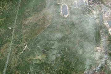 A destructive wildfire burned through Canada’s Northern Alberta region, razing neighborhoods in Fort McMurray and displacing tens of thousands of residents. Image: NASA Earth Observatory