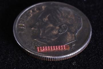 
              Silk microneedle array on a U.S. dime
              Image courtesy of SMART.
      