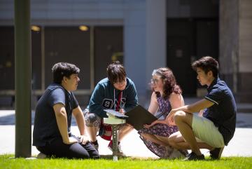 
              Left to right: Fabian Velasquez, Rafael Olivera-Cintron, Katherine Mohr, and Michael Lu test their solar-powered sensor in a sunny spot on the MIT campus. 
              Photo: Gretchen Ertl
      